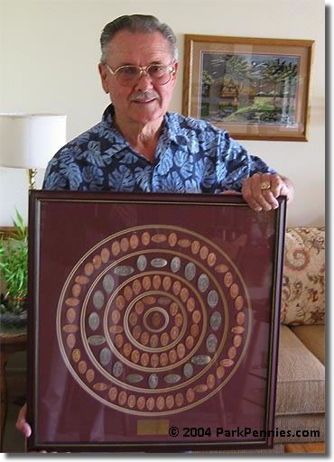 Yes, he is holding the framed penny collection real tightly! Bill Hogarth elongated coin collection
