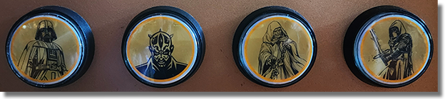 Buttons for the Tomorrowland attractions themed medallion vending machine #3 offering medallion guide numbers 10, 11, 12, 13 image taken the first day onstage, 10/13/2022.